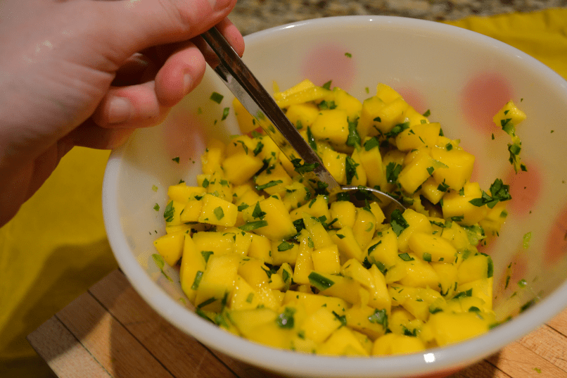 mango salsa stir hand