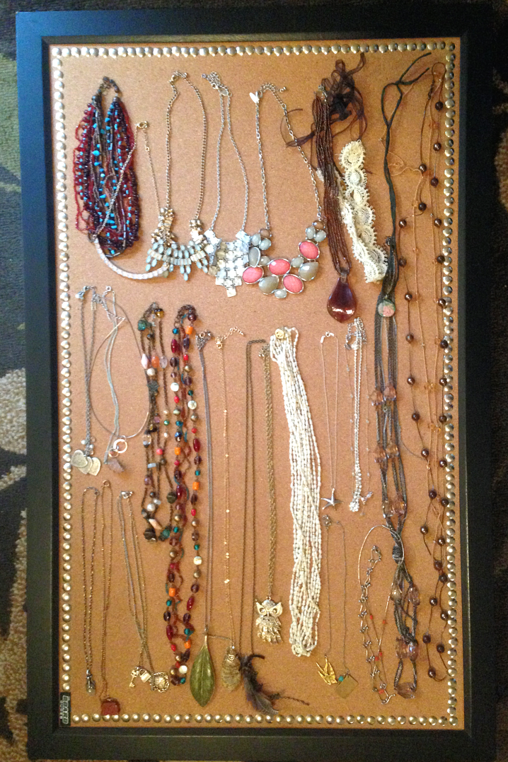 Jewelry laid out on bulletin board